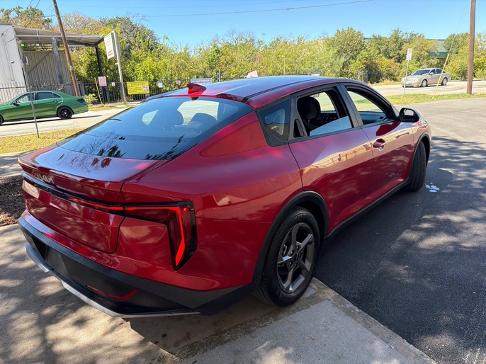 2025 Kia K4 LXS red rear quarter view VIN 3KPFT4DE7SE033635 Dallas TX