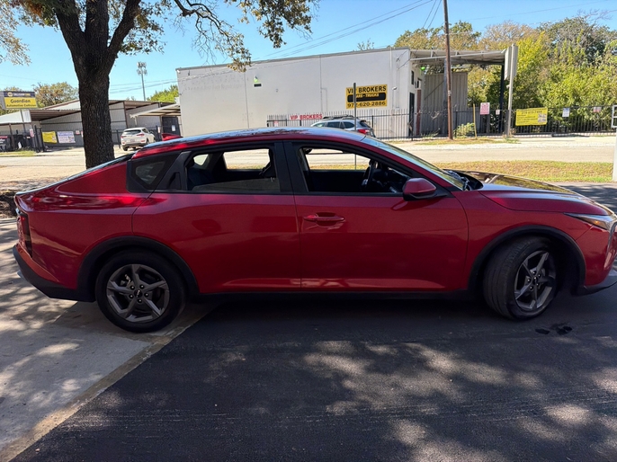 2025 Kia K4 LXS red passenger side profile VIN 3KPFT4DE7SE033635 Dallas TX